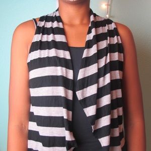 A grey and black sleeveless sweater